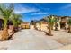 Beautiful home exterior with desert landscaping, a spacious driveway, and charming curb appeal at 11737 N 143Rd Dr, Surprise, AZ 85379