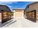 A detached two-car garage with an automatic door and custom gate at 11737 N 143Rd Dr, Surprise, AZ 85379