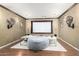 Inviting home theater with comfortable seating, a large projection screen, and wall sconces at 11737 N 143Rd Dr, Surprise, AZ 85379