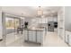 Modern, spacious kitchen with large island, stainless appliances, and access to backyard dining at 11737 N 143Rd Dr, Surprise, AZ 85379