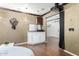 A comfortable media space featuring stylish lighting, decor, and hard wood floors at 11737 N 143Rd Dr, Surprise, AZ 85379