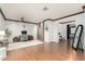 Open concept living area with hardwood floors, ceiling fan, and an abundance of natural light at 11737 N 143Rd Dr, Surprise, AZ 85379