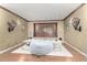 A cozy media space featuring stylish lighting, decor, and hard wood floors at 11737 N 143Rd Dr, Surprise, AZ 85379