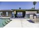 Inviting covered patio with dining set, outdoor kitchen, and a refreshing pool with step entry at 1191 E Avenida Fresca St, Casa Grande, AZ 85122