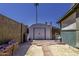 Large backyard featuring a storage shed, brick pathway, and ample space for outdoor activities at 1191 E Avenida Fresca St, Casa Grande, AZ 85122