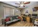 Functional bedroom space with a futon, desk, and natural light at 1191 E Avenida Fresca St, Casa Grande, AZ 85122