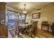Elegant dining room with wood flooring, picturesque window, and seating for six at 1191 E Avenida Fresca St, Casa Grande, AZ 85122