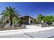 Beautiful home featuring mature palm trees, a lush lawn, and a private fenced yard at 1191 E Avenida Fresca St, Casa Grande, AZ 85122