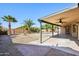 Entertain in style under the covered patio overlooking the inviting backyard pool and lush landscaping at 12217 W Edgemont Ave, Avondale, AZ 85392
