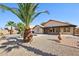 View of the backyard of a charming home, complete with a pool, covered patio, and desert landscaping at 12217 W Edgemont Ave, Avondale, AZ 85392