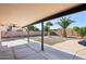 This spacious backyard features desert landscaping, a covered patio, and a pool for the best outdoor living at 12217 W Edgemont Ave, Avondale, AZ 85392