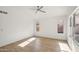 Bright bedroom with large windows and neutral walls at 12217 W Edgemont Ave, Avondale, AZ 85392