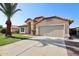 Charming single-story home with a well-manicured lawn, desert landscaping, and two car garage at 12217 W Edgemont Ave, Avondale, AZ 85392