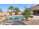 Sparkling backyard pool area with rock features and desert landscaping to create a relaxing atmosphere at 12217 W Edgemont Ave, Avondale, AZ 85392