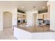 Kitchen with island, stainless steel appliances, and plenty of cabinet space at 12721 W Georgia Ave, Litchfield Park, AZ 85340