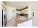Kitchen with island, stainless steel appliances, and plenty of cabinet space at 12721 W Georgia Ave, Litchfield Park, AZ 85340