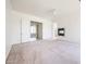 Open-concept living room with a fireplace and slider to the backyard offers abundant space at 12721 W Georgia Ave, Litchfield Park, AZ 85340