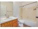 Bathroom features a shower-tub combo, a single sink vanity, and neutral finishes at 13599 W Monte Vista Rd, Goodyear, AZ 85395