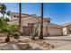 Charming two-story home with a desert landscape and attached three car garage at 13599 W Monte Vista Rd, Goodyear, AZ 85395