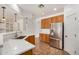 Modern kitchen featuring stainless steel appliances, breakfast bar, and tile flooring at 13599 W Monte Vista Rd, Goodyear, AZ 85395
