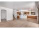 Modern kitchen featuring a breakfast bar, stainless steel appliances, and tile flooring at 13599 W Monte Vista Rd, Goodyear, AZ 85395