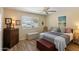 Bedroom features a bed, wooden furnishings, and a window with blinds at 13807 N Garden Court Dr, Sun City, AZ 85351