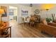 Cozy dining area features a round wooden table with seating and stylish accents at 13807 N Garden Court Dr, Sun City, AZ 85351