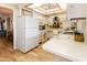 Charming kitchen features white cabinetry, appliances, and a bright, airy atmosphere at 13807 N Garden Court Dr, Sun City, AZ 85351