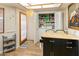 Practical laundry area with washer, dryer, and ample storage space for supplies at 13807 N Garden Court Dr, Sun City, AZ 85351