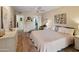 Bedroom with a ceiling fan, ensuite bathroom, and walk-in closet at 13807 N Garden Court Dr, Sun City, AZ 85351