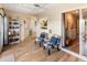 Inviting sun room with wood floors, comfortable seating, and sliding doors for indoor/outdoor living at 13807 N Garden Court Dr, Sun City, AZ 85351