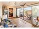 Bright sunroom offering access to a private outdoor patio, natural light and plenty of indoor storage at 13807 N Garden Court Dr, Sun City, AZ 85351