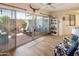 Cozy sunroom featuring access to a private patio, natural light, and comfortable furniture at 13807 N Garden Court Dr, Sun City, AZ 85351