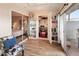 Versatile sun room with wood floors, natural light, and access to the patio and other rooms at 13807 N Garden Court Dr, Sun City, AZ 85351