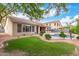 Lush backyard featuring a private pool, mature trees, and beautiful landscaping at 139 E Gail Dr, Gilbert, AZ 85296