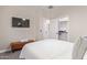 Bedroom features TV, large walk in closet, and leather bed bench at 139 E Gail Dr, Gilbert, AZ 85296