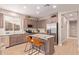 Bright kitchen with stainless steel appliances, granite counters, and center island at 139 E Gail Dr, Gilbert, AZ 85296