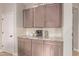 Kitchen coffee bar area with granite counters and plentiful cabinet space at 139 E Gail Dr, Gilbert, AZ 85296