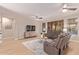 Inviting living room showcasing plush leather seating, decorative rug, and a large flat screen television at 139 E Gail Dr, Gilbert, AZ 85296