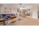 Open-concept living room and kitchen with modern light fixtures and dining area at 139 E Gail Dr, Gilbert, AZ 85296