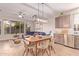 Open-concept living room and dining room area with large windows and modern finishes at 139 E Gail Dr, Gilbert, AZ 85296