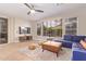 Cozy living room featuring a large sectional, modern furniture, and wood look flooring at 139 E Gail Dr, Gilbert, AZ 85296