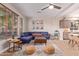 Open-concept living room featuring a large sectional, modern furniture, and stylish decor at 139 E Gail Dr, Gilbert, AZ 85296