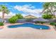 Backyard pool showcasing a waterfall feature and concrete patio at 139 E Gail Dr, Gilbert, AZ 85296