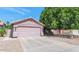 Charming single-Gathering home with a well-maintained front yard and a two-car garage at 15740 N 91St Dr, Peoria, AZ 85382