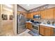 Well-equipped kitchen with stainless steel appliances and ample cabinet space at 15740 N 91St Dr, Peoria, AZ 85382