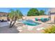 Inviting backyard pool and spa area with lounge seating and desert landscaping at 15740 N 91St Dr, Peoria, AZ 85382