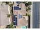 Home with solar panels, a backyard pool, and desert landscaping from an aerial perspective at 16186 W Port Royale Ln, Surprise, AZ 85379