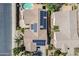 Features home with a backyard swimming pool, solar panels, and mature landscaping at 16186 W Port Royale Ln, Surprise, AZ 85379