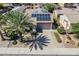 Charming home with solar panels, well-kept landscaping, and a paved driveway at 16186 W Port Royale Ln, Surprise, AZ 85379